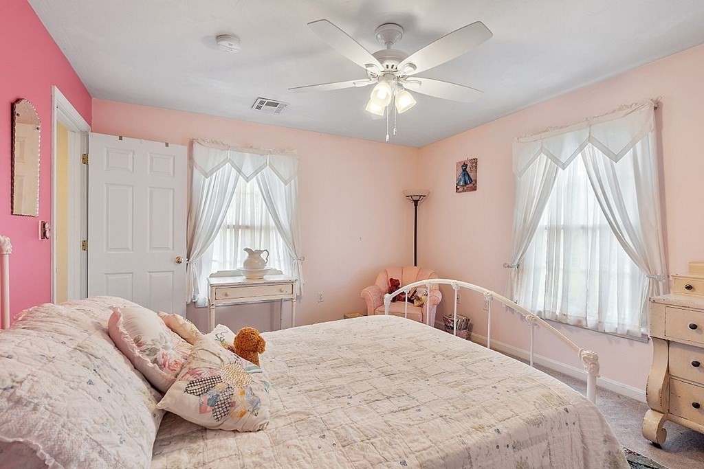 299 South Meadow Road Lancaster, MA 01523 - Photo 39 of 41 a bedroom with a bed and a window