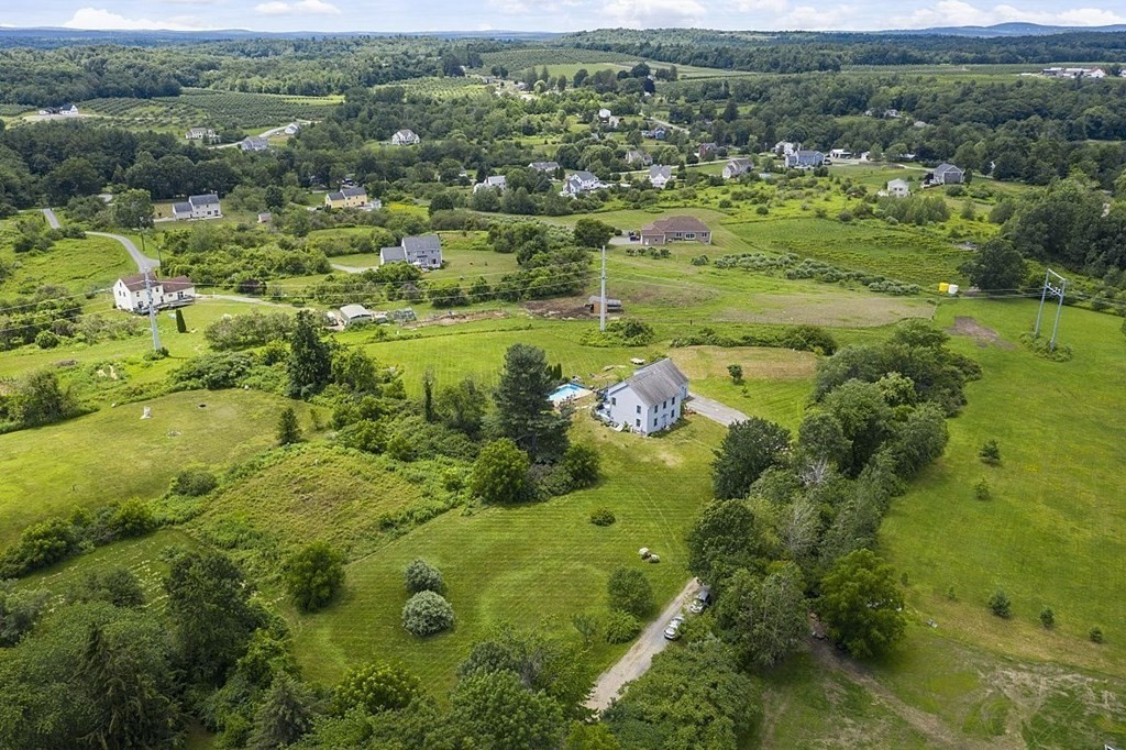 299 South Meadow Road Lancaster, MA 01523 - Photo 7 of 41 a view of a garden with a lake