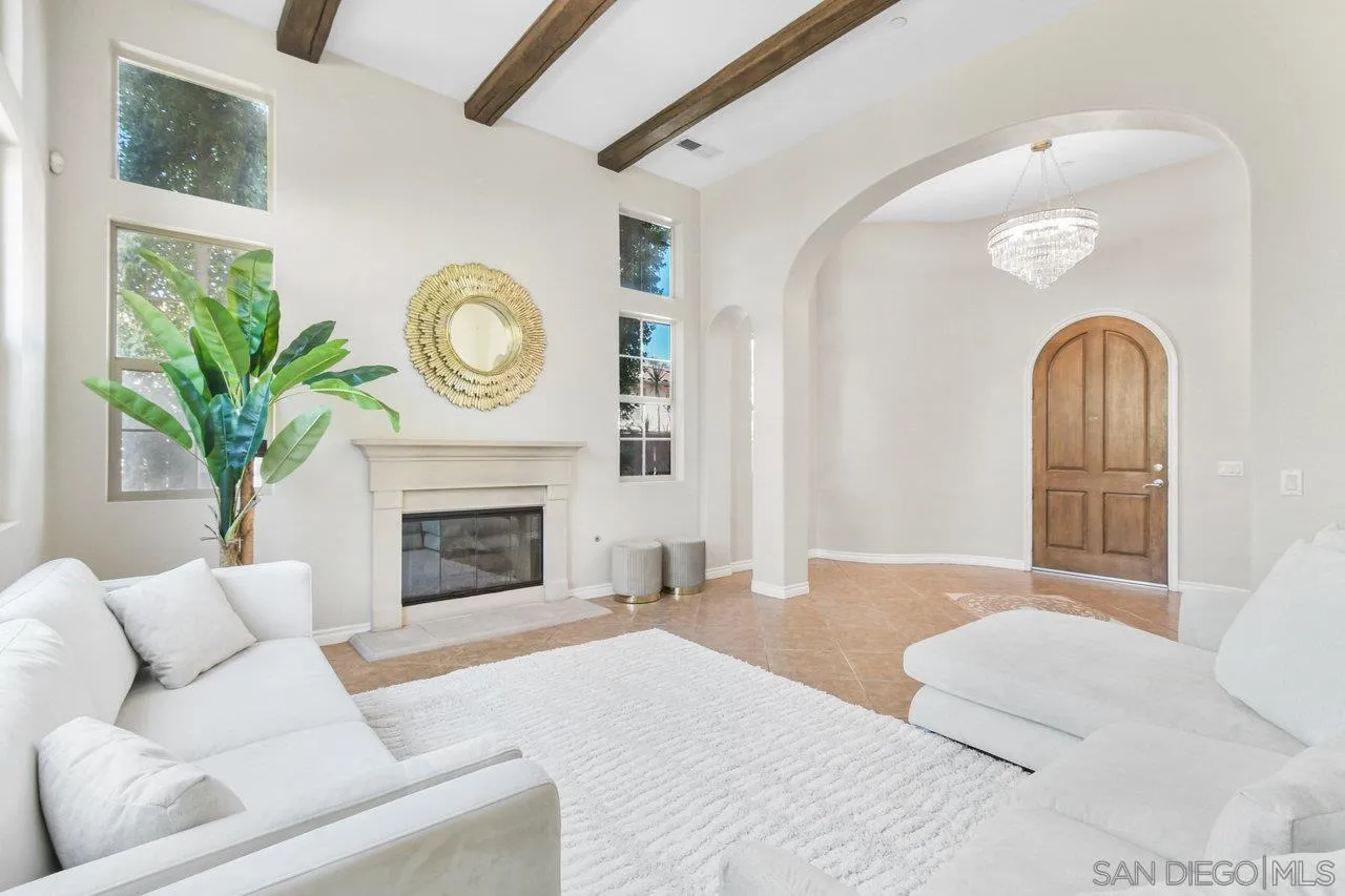 2957 Ranch Gate Road Chula Vista, CA 91914 - Photo 7 of 75 a living room with furniture a fireplace and a potted plant