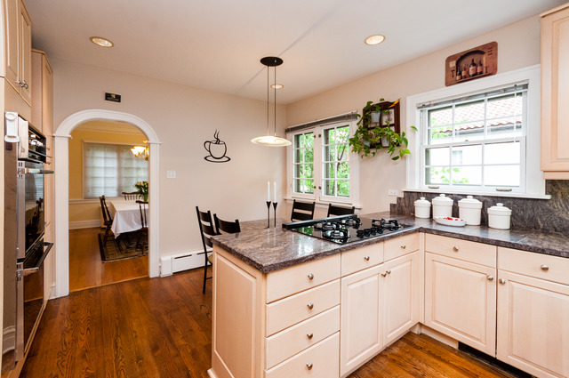 511 Lathrop Avenue River Forest, IL 60305 - Photo 12 of 25 a kitchen with granite countertop a sink and cabinets