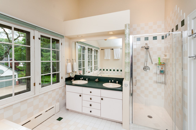 511 Lathrop Avenue River Forest, IL 60305 - Photo 18 of 25 a bathroom with a granite countertop sink a large mirror a shower and a bathtub