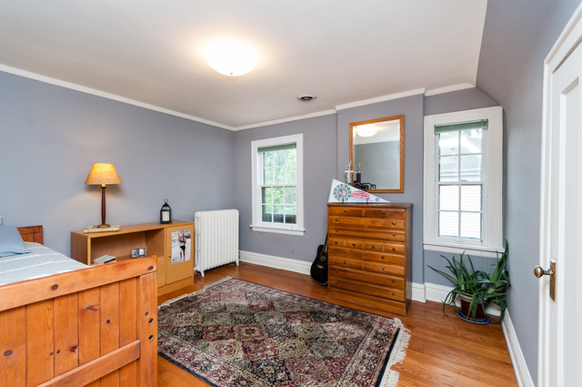 511 Lathrop Avenue River Forest, IL 60305 - Photo 19 of 25 a view of a room that has a couch and a potted plant