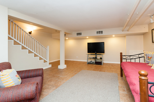 511 Lathrop Avenue River Forest, IL 60305 - Photo 23 of 25 a view of a livingroom with furniture and a flat screen tv