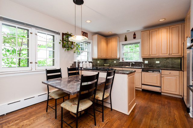 511 Lathrop Avenue River Forest, IL 60305 - Photo 10 of 25 a kitchen with a table chairs stove and cabinets