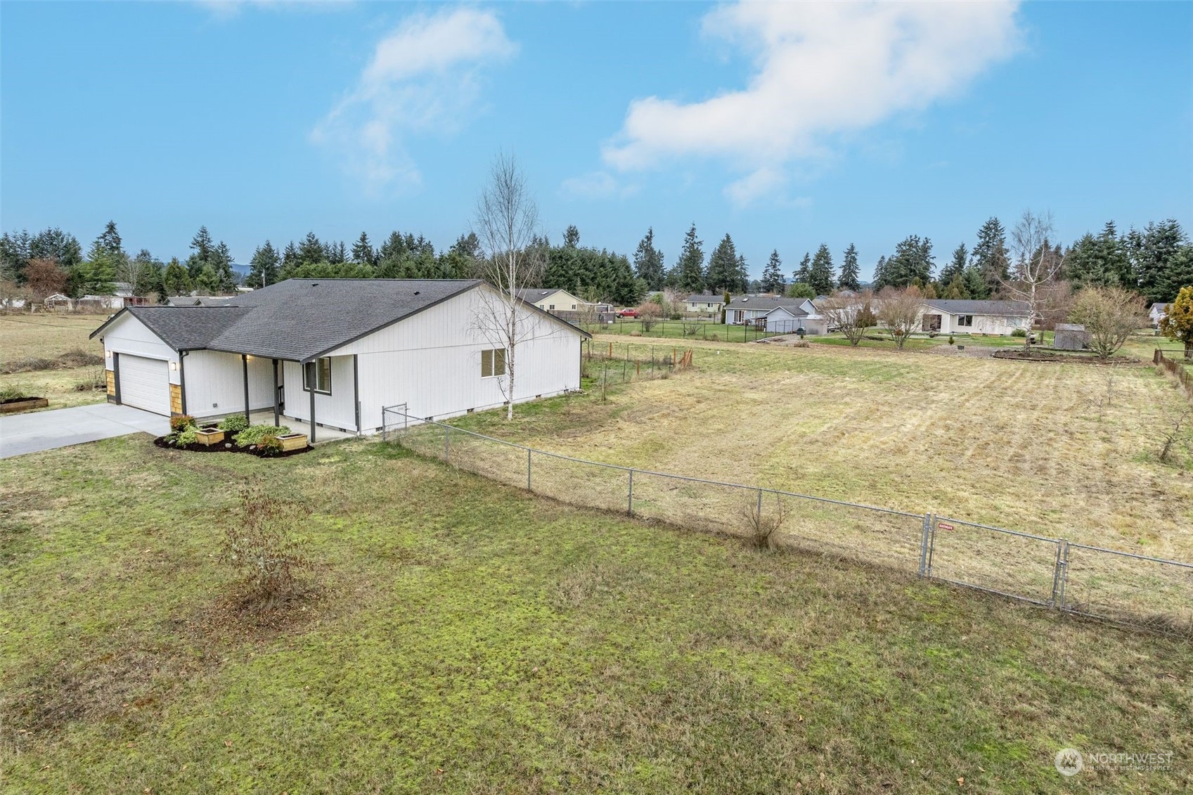 6742 187th Avenue Southwest Rochester, WA 98579 - Photo 24 of 27 a view of a house with a yard and lake view