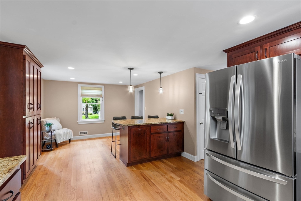 61 Pine Ridge Drive Franklin, MA 02038 - Photo 16 of 41 a kitchen with stainless steel appliances granite countertop a refrigerator stove and oven