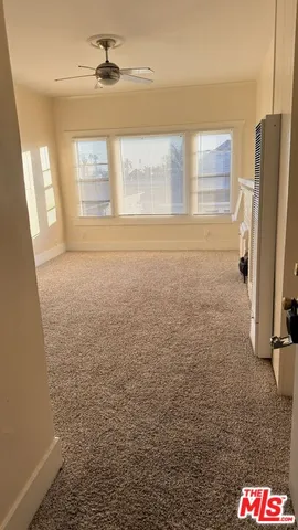 a bathroom with shower cabinet and a window