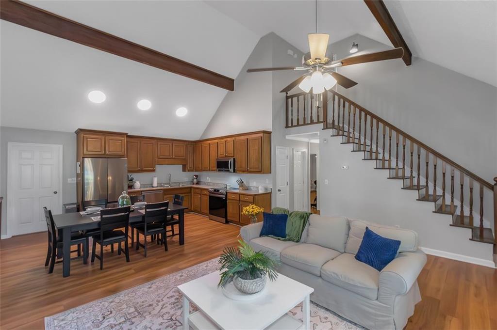 150 Mackey Road McDonough, GA 30252 - Photo 15 of 38 a living room with furniture kitchen view and a wooden floor