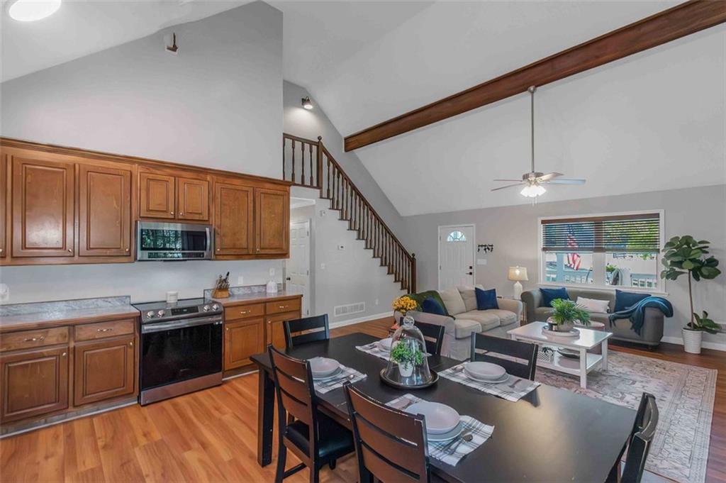 150 Mackey Road McDonough, GA 30252 - Photo 17 of 38 a living room with furniture kitchen view and a wooden floor