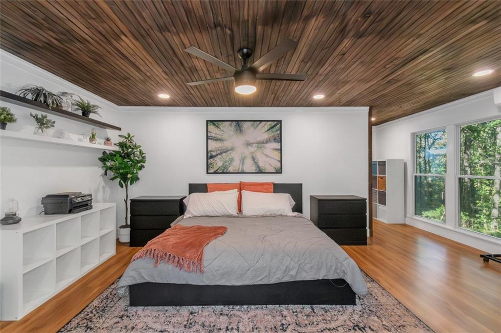 150 Mackey Road McDonough, GA 30252 - Photo 20 of 38 a bedroom with a large bed and a potted plant