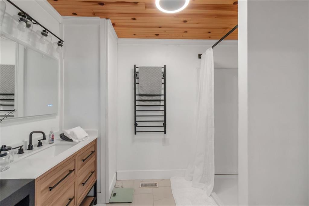 150 Mackey Road McDonough, GA 30252 - Photo 24 of 38 a bathroom with a sink and a mirror