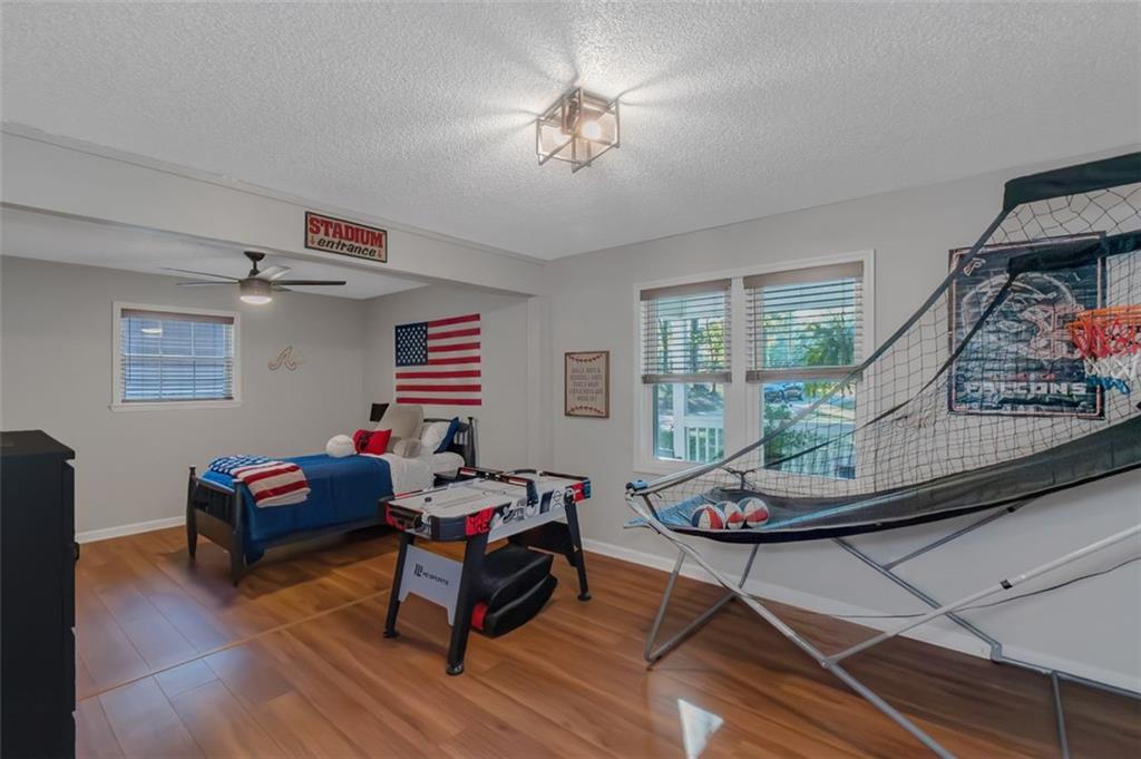 150 Mackey Road McDonough, GA 30252 - Photo 31 of 38 a living room with furniture and a flat screen tv