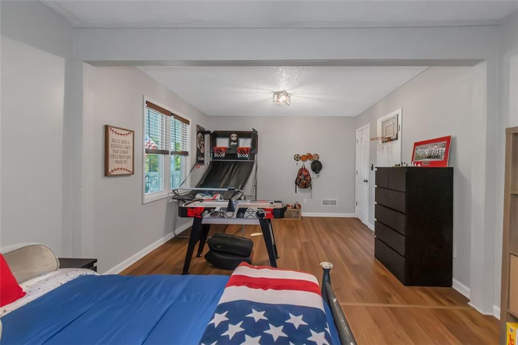 150 Mackey Road McDonough, GA 30252 - Photo 32 of 38 a living room with furniture and a flat screen tv