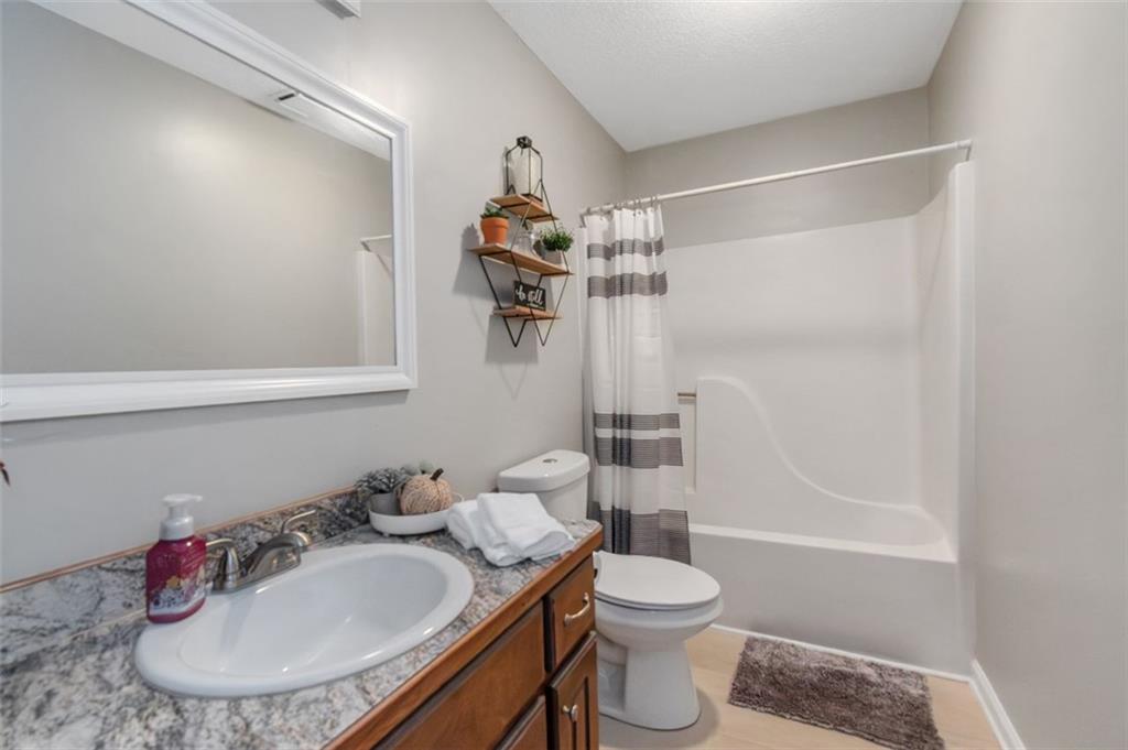 150 Mackey Road McDonough, GA 30252 - Photo 34 of 38 a bathroom with a sink toilet and shower