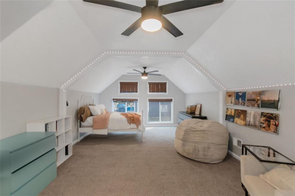 150 Mackey Road McDonough, GA 30252 - Photo 36 of 38 a living room with furniture and a chandelier