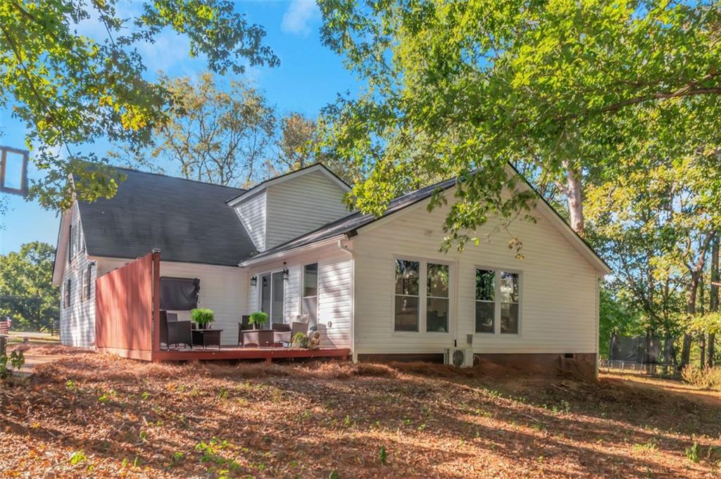 150 Mackey Road McDonough, GA 30252 - Photo 7 of 38 a view of a house with a yard and large tree