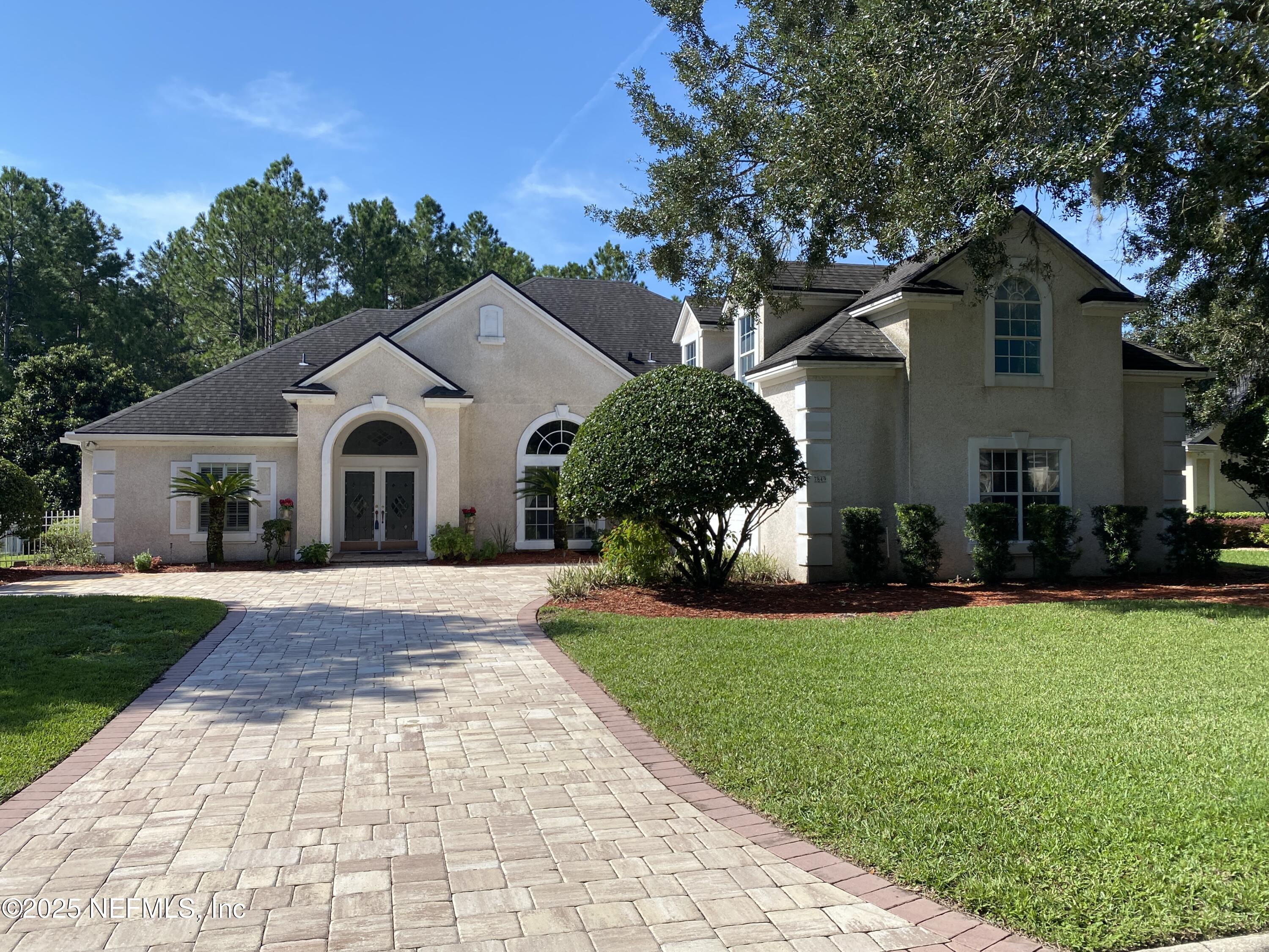 a view of outdoor space yard and front view of a house