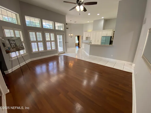 a view of an entryway with wooden floor