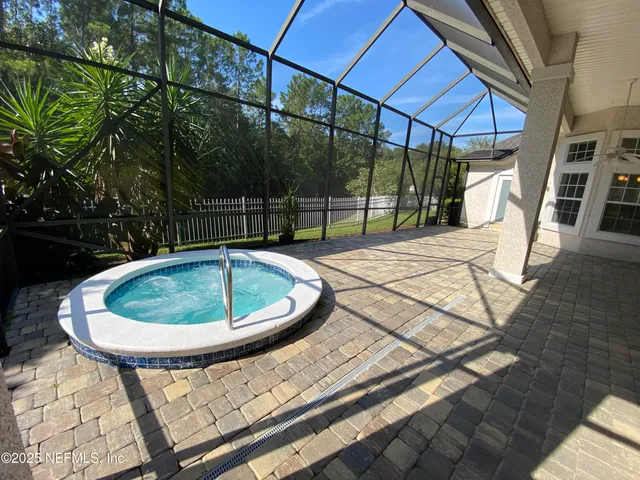 a view of a swimming pool with a patio