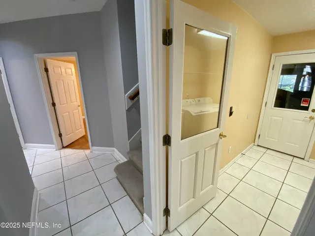 a utility room with dryer and washer
