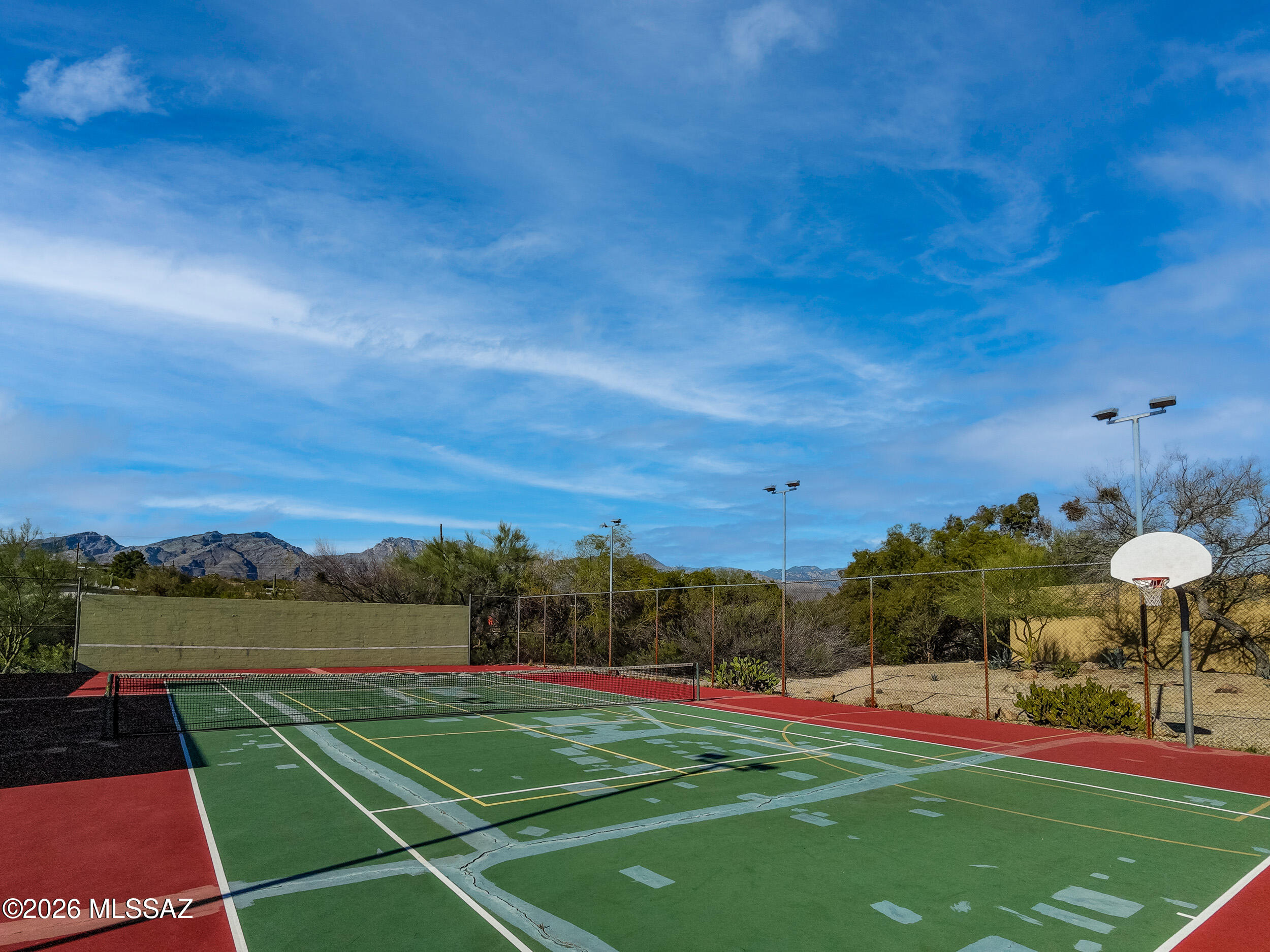 6941 East Rivercrest Road Tucson, AZ 85750 - Photo 28 of 32 a view of an outdoor space and tennis court
