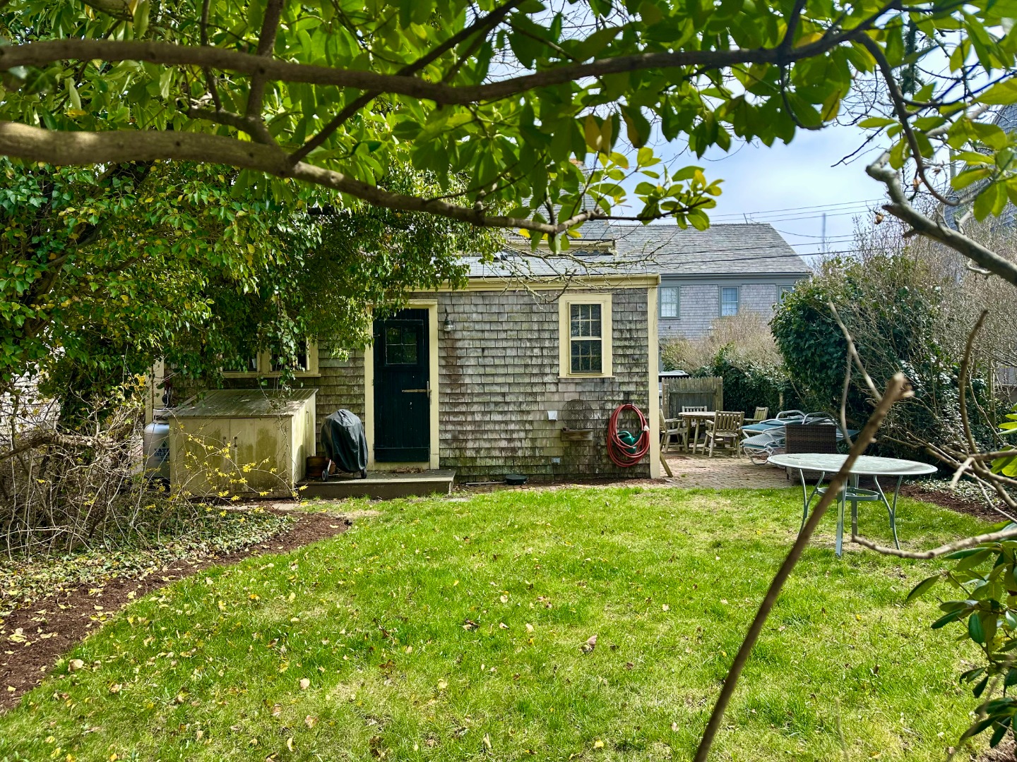 1 Beaver Street Nantucket, MA 02554 - Photo 5 of 28 a view of a house with swimming pool and a yard
