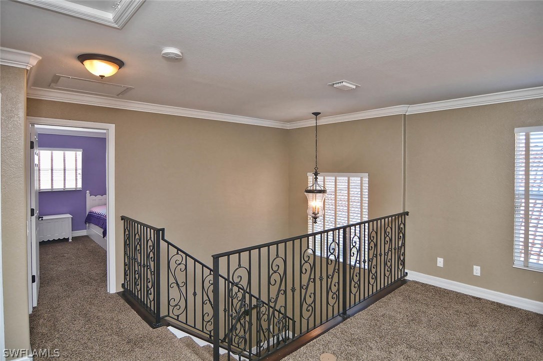 12357 Rock Ridge Lane Fort Myers, FL 33913 - Photo 12 of 25 a view of a hallway with windows