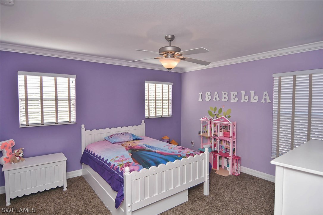 12357 Rock Ridge Lane Fort Myers, FL 33913 - Photo 13 of 25 a bedroom with a bed closet and a window