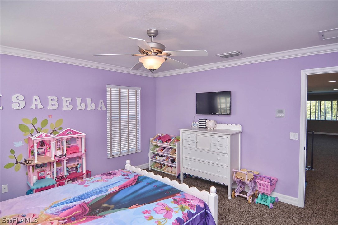 12357 Rock Ridge Lane Fort Myers, FL 33913 - Photo 14 of 25 a bedroom with a bed and flat screen tv