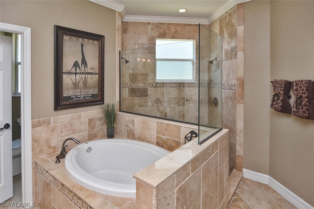 12357 Rock Ridge Lane Fort Myers, FL 33913 - Photo 18 of 25 a bathroom with a tub and a sink