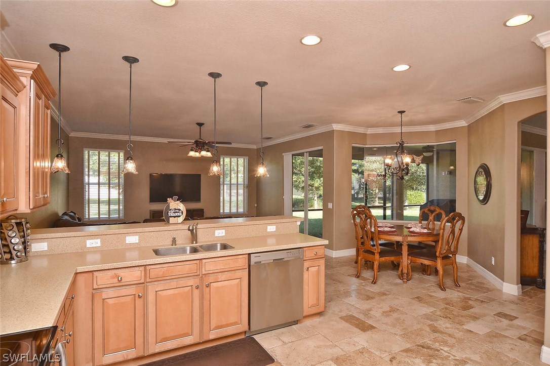 12357 Rock Ridge Lane Fort Myers, FL 33913 - Photo 20 of 25 a large kitchen with lots of counter space and furniture