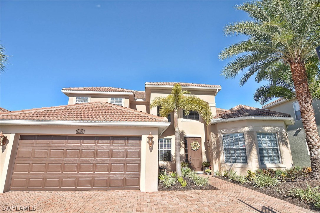 12357 Rock Ridge Lane Fort Myers, FL 33913 - Photo 2 of 25 a front view of a house