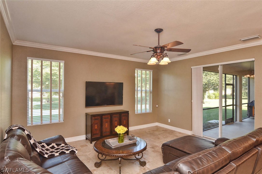 12357 Rock Ridge Lane Fort Myers, FL 33913 - Photo 22 of 25 a living room with furniture and a flat screen tv