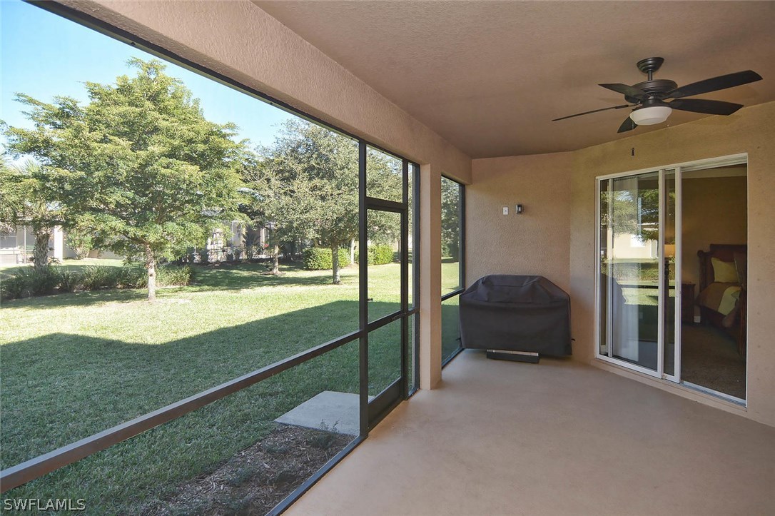 12357 Rock Ridge Lane Fort Myers, FL 33913 - Photo 24 of 25 a living room with yard and balcony