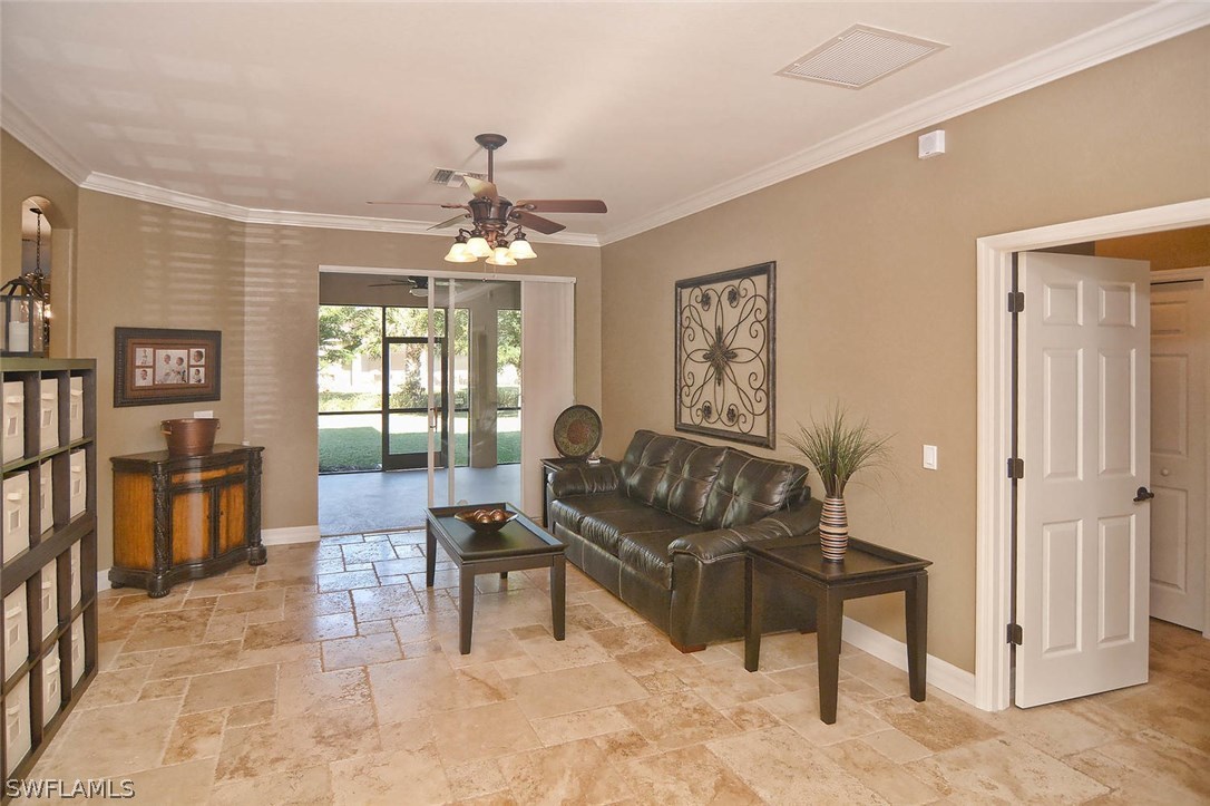 12357 Rock Ridge Lane Fort Myers, FL 33913 - Photo 3 of 25 a living room with furniture and a chandelier