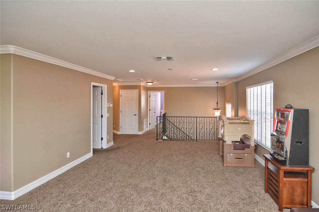 12357 Rock Ridge Lane Fort Myers, FL 33913 - Photo 5 of 25 a view of a livingroom with furniture and a flat screen tv