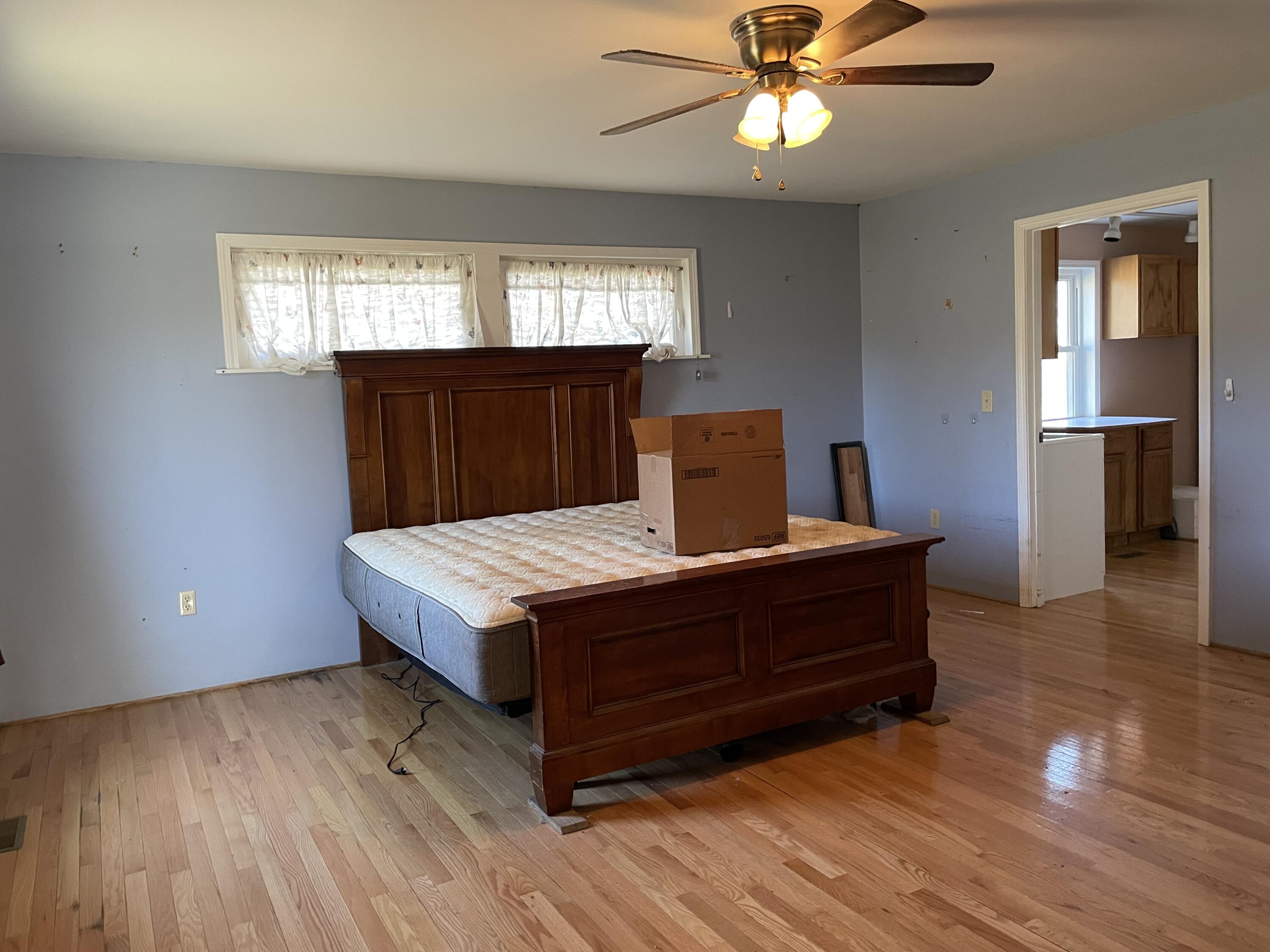 2047 Botetourt Road Fincastle, VA 24090 - Photo 7 of 11 a living room with a bed furniture and a window