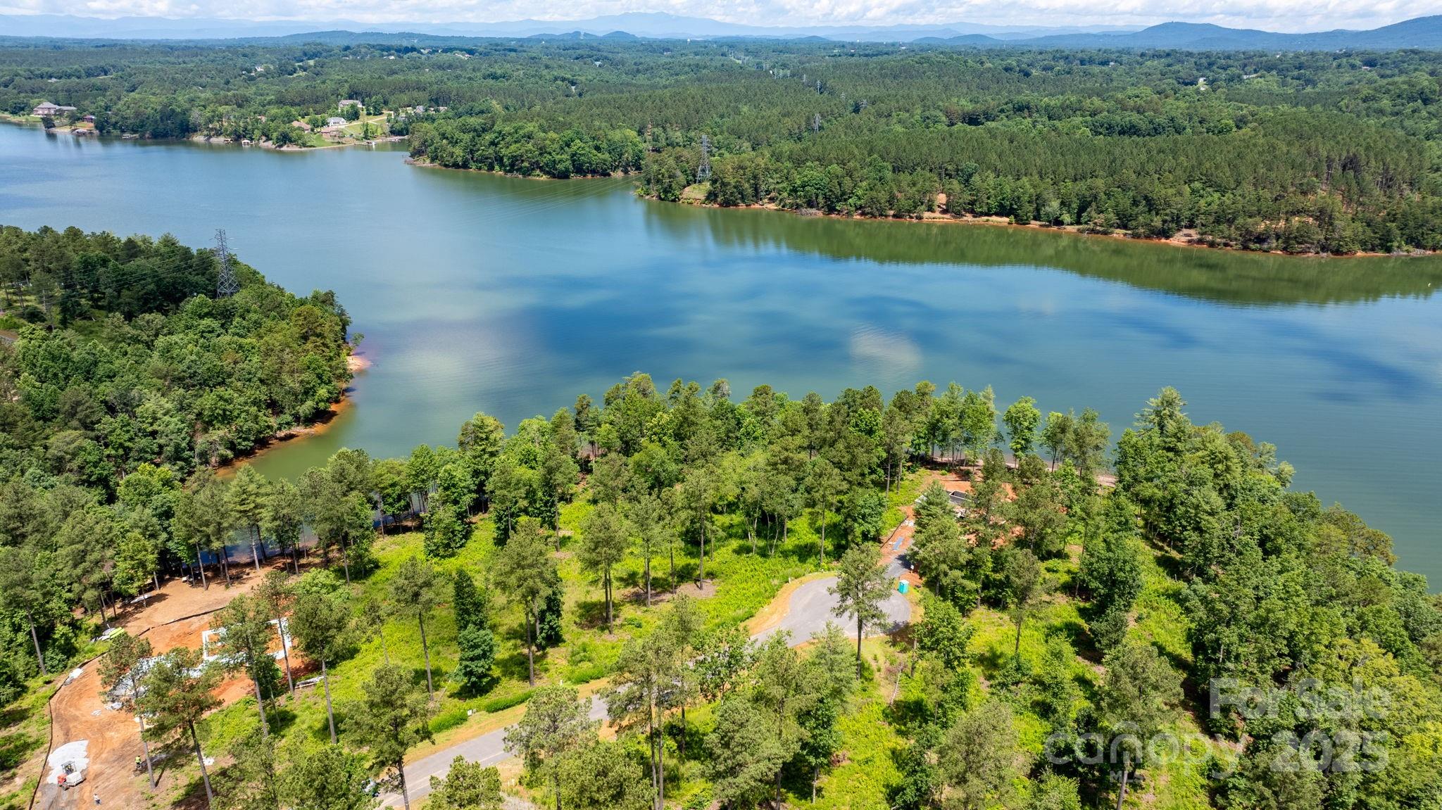 3085 Jumping Run, Unit 101 Connelly Springs, NC 28612 - Photo 7 of 17 an aerial view of a houses with outdoor space and lake view