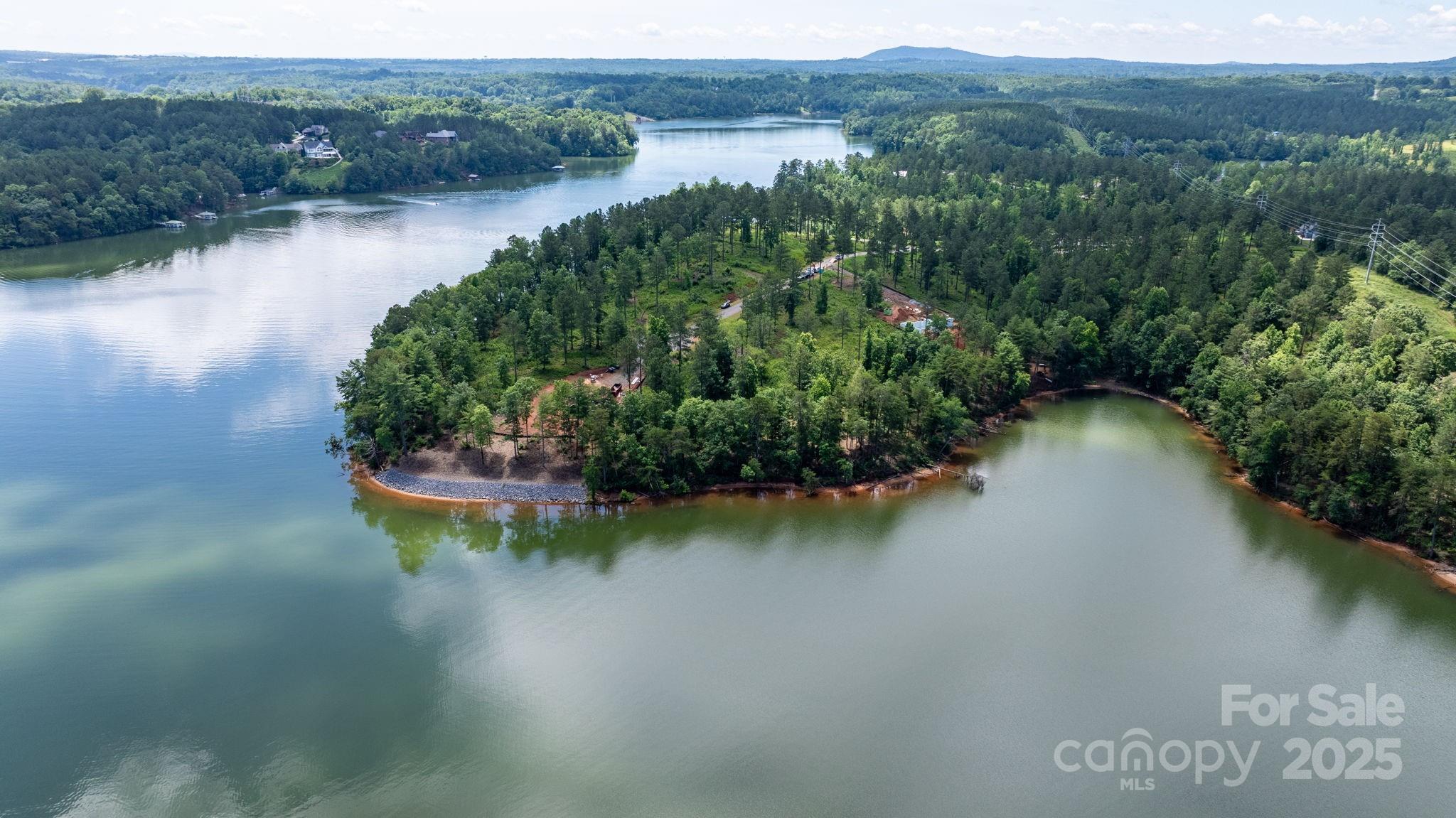 3085 Jumping Run, Unit 101 Connelly Springs, NC 28612 - Photo 10 of 17 an aerial view of a house with a lake view