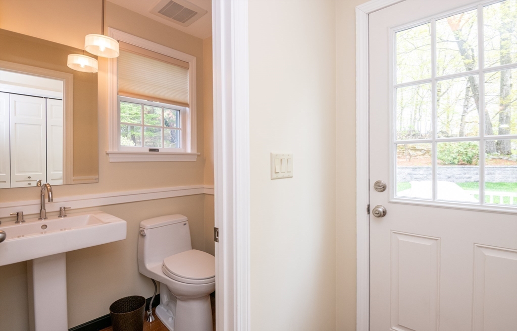 25 Ellen Road Stoneham, MA 02180 - Photo 20 of 41 a white toilet sitting next to a bathroom sink