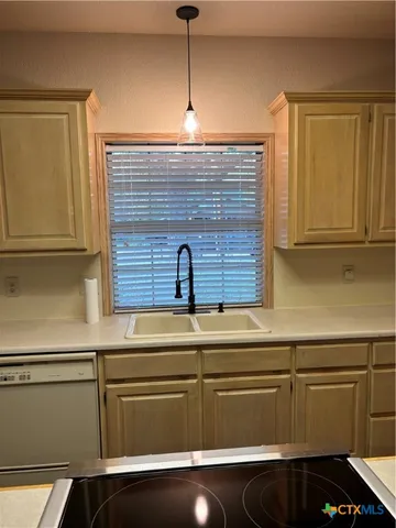 a view of a hallway with a chandelier