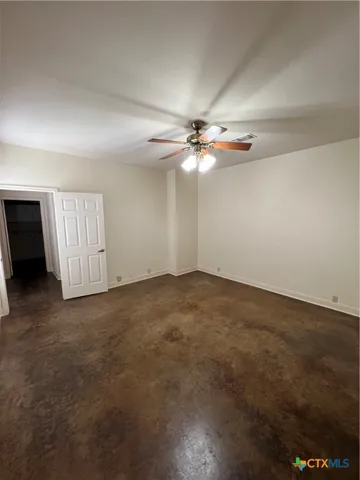 a view of a roof deck with wooden fence and a couple of chairs
