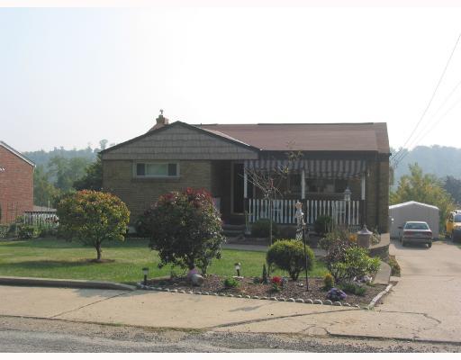 3896 Willett Road Baldwin, PA 15227 - Photo 1 of 7 Exterior Front. Beautifully landscaped. Level front walkway leading to the covered front porch. Concrete driveway with extra parking. The shed is included.