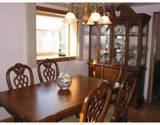 3896 Willett Road Baldwin, PA 15227 - Photo 3 of 7 Dining Room. Exposed hardwood floors and neutral painted walls. There is an attractive chandelier and garden window with custom vertical blinds . Opens to kitchen and familyroom.