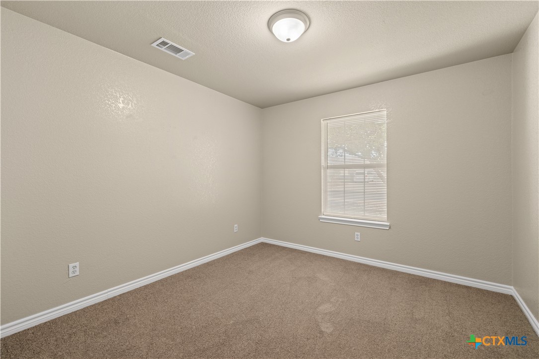 217 Timber Ridge Drive Nolanville, TX 76559 - Photo 15 of 25 an empty room with a empty space and windows
