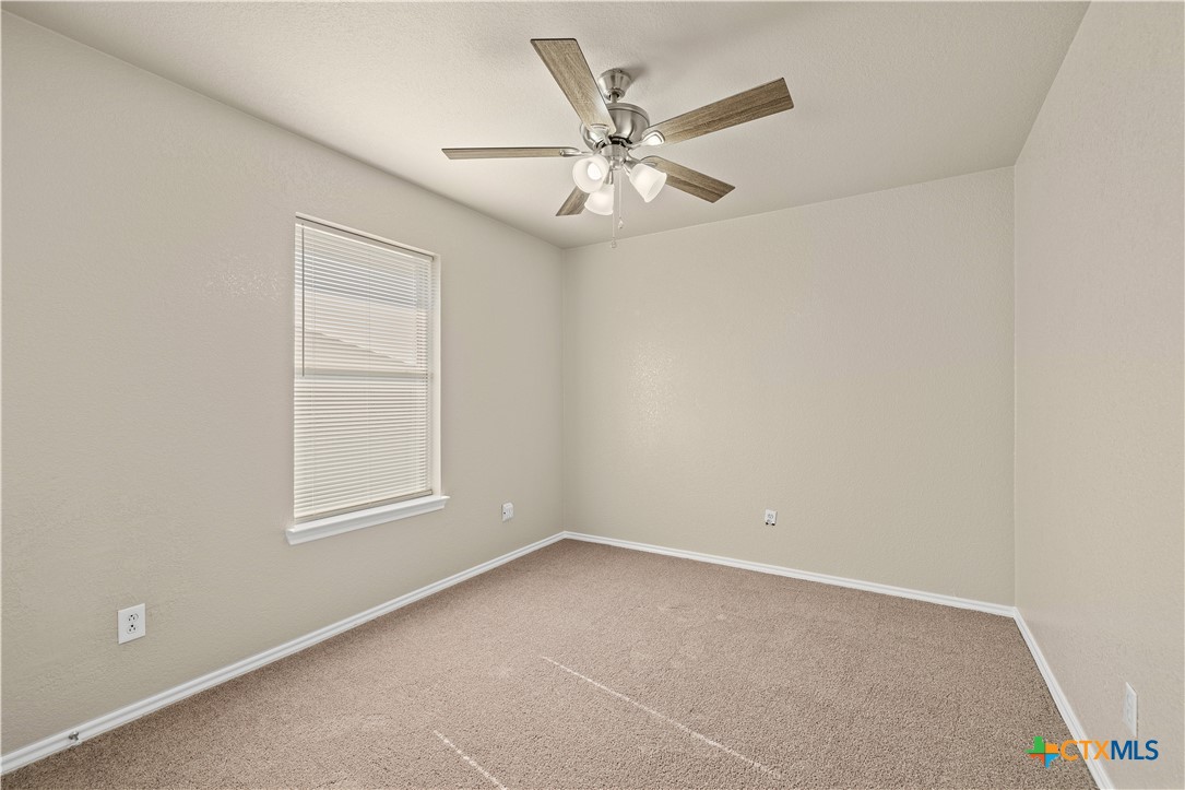 217 Timber Ridge Drive Nolanville, TX 76559 - Photo 17 of 25 an empty room with windows and fan