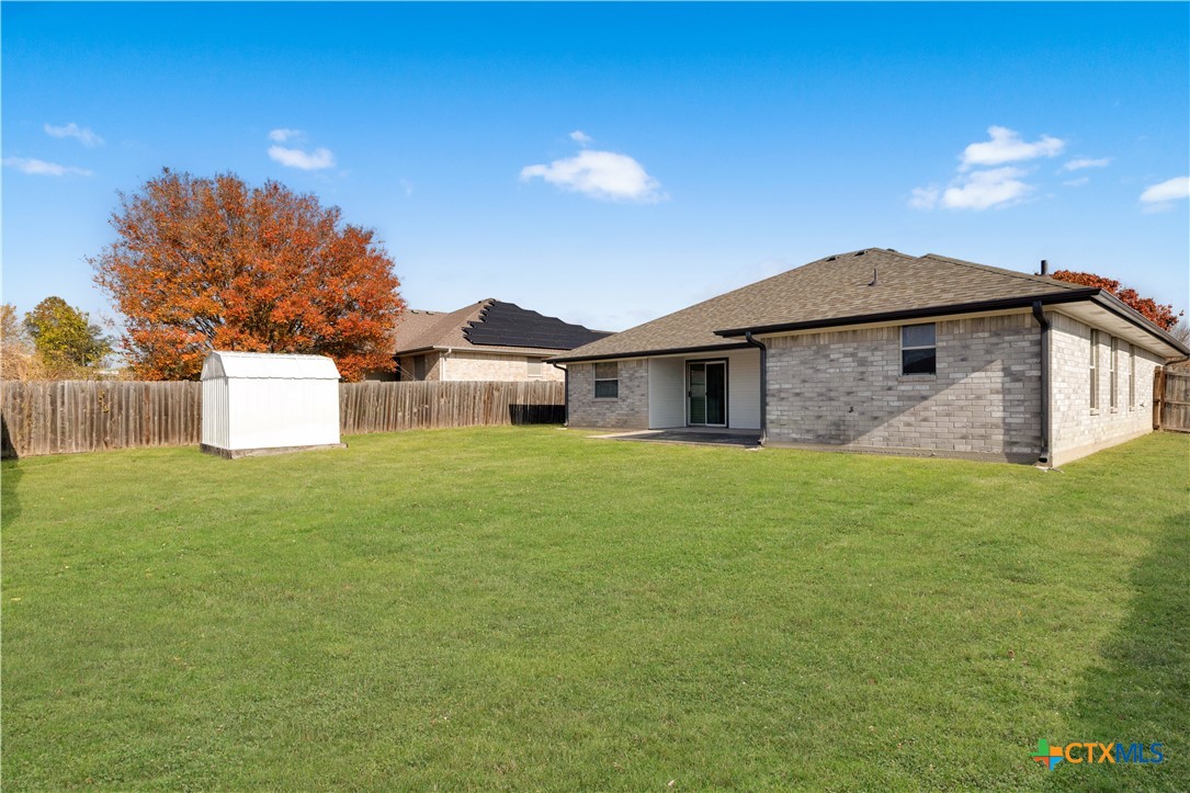 217 Timber Ridge Drive Nolanville, TX 76559 - Photo 23 of 25 a front view of a house with a garden and yard