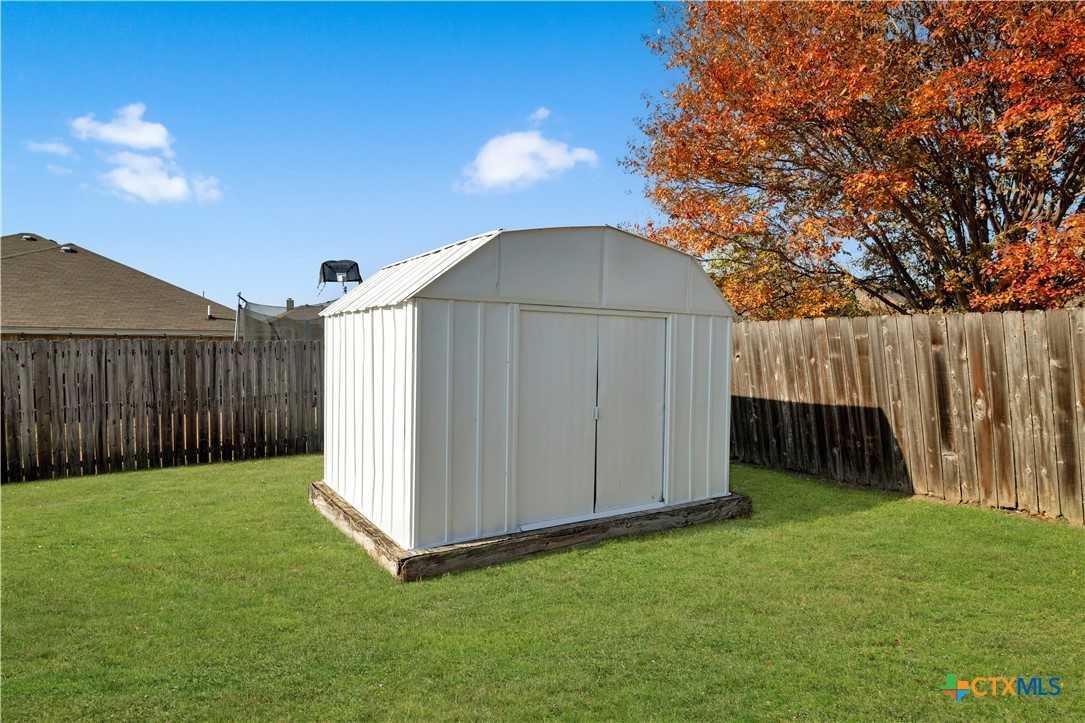 217 Timber Ridge Drive Nolanville, TX 76559 - Photo 25 of 25 a view of backyard with tub and trees