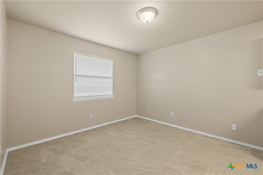 217 Timber Ridge Drive Nolanville, TX 76559 - Photo 8 of 25 an empty room with a window