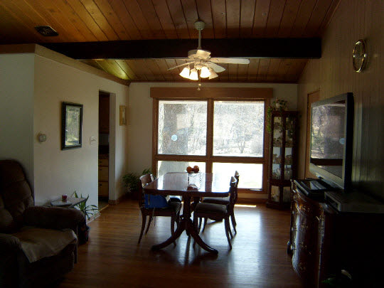 3117 Spring Creek Road Rockford, IL 61107 - Photo 3 of 11 a view of a dining room with furniture window and wooden floor